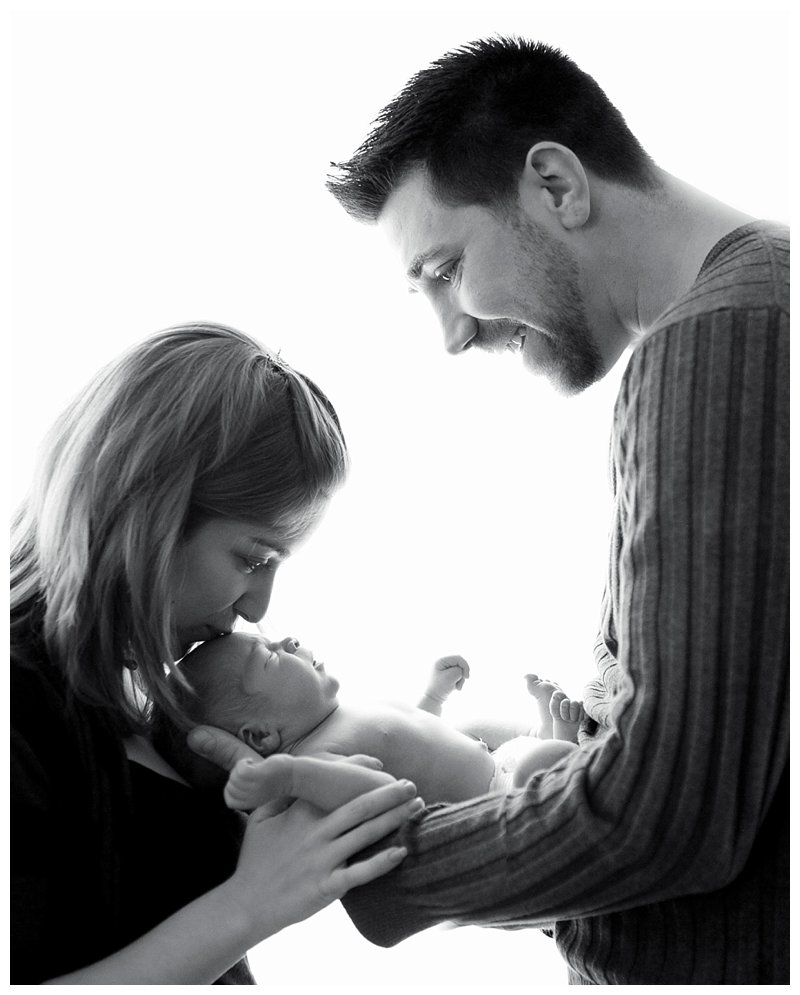 mom and dad holding baby.jpg mom and dad holding baby.jpg