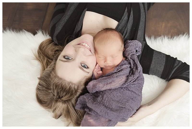 mom posed with newborn.jpg Buffalo Newborn Photographer.jpg